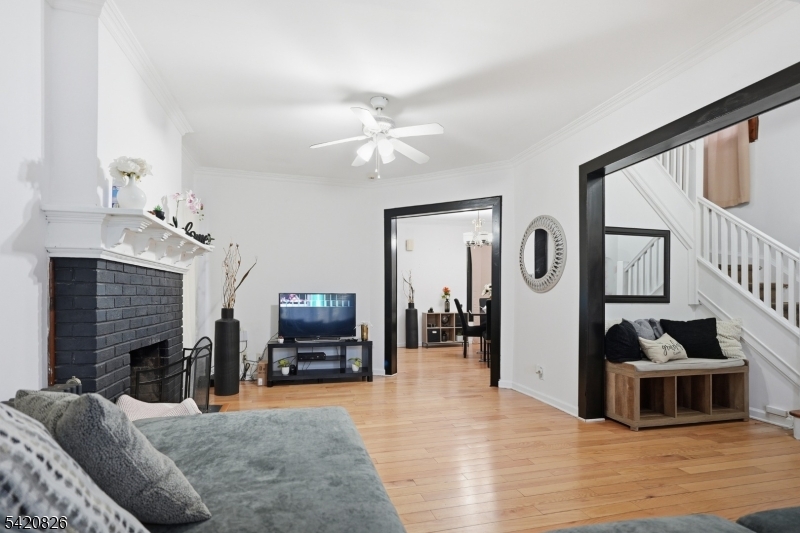 923-925 Kilsyth Road Elizabeth, NJ 07208 - Photo 7 of 24 a living room with furniture and a fireplace