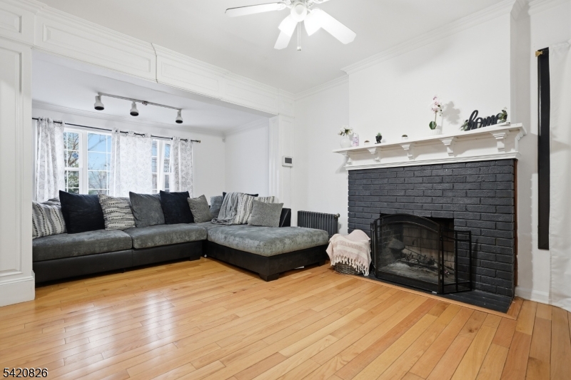 923-925 Kilsyth Road Elizabeth, NJ 07208 - Photo 8 of 24 a living room with furniture and a fireplace