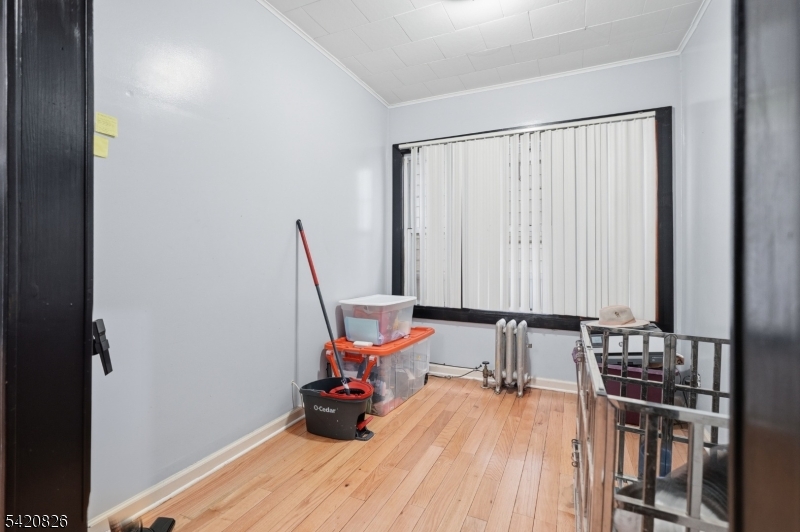 923-925 Kilsyth Road Elizabeth, NJ 07208 - Photo 9 of 24 a workspace with furniture and wooden floor