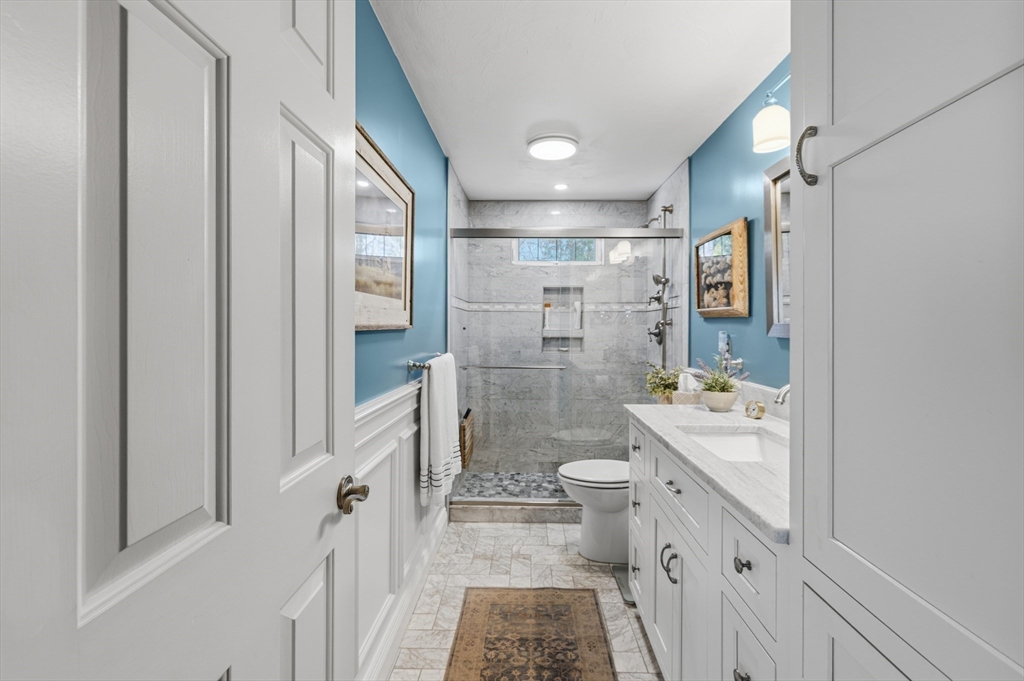 1 Susan Carsley Way Sandwich, MA 02563 - Photo 11 of 39 a bathroom with a double vanity sink toilet and shower
