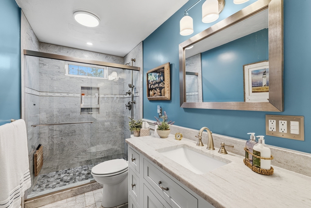 1 Susan Carsley Way Sandwich, MA 02563 - Photo 2 of 39 a bathroom with a sink toilet and shower