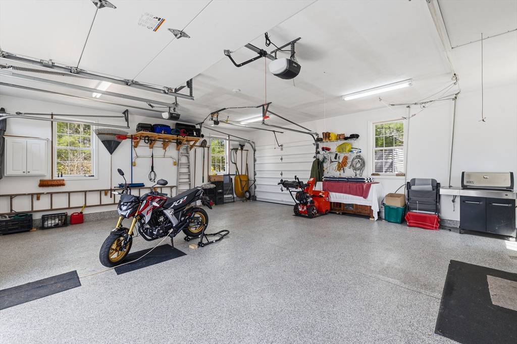 1 Susan Carsley Way Sandwich, MA 02563 - Photo 29 of 39 a view of a garage with a bike and a car