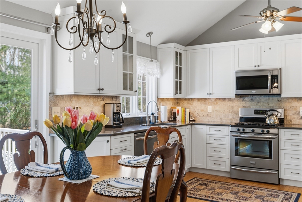 1 Susan Carsley Way Sandwich, MA 02563 - Photo 3 of 39 a kitchen with stainless steel appliances granite countertop a white cabinets a stove top oven a sink and dishwasher
