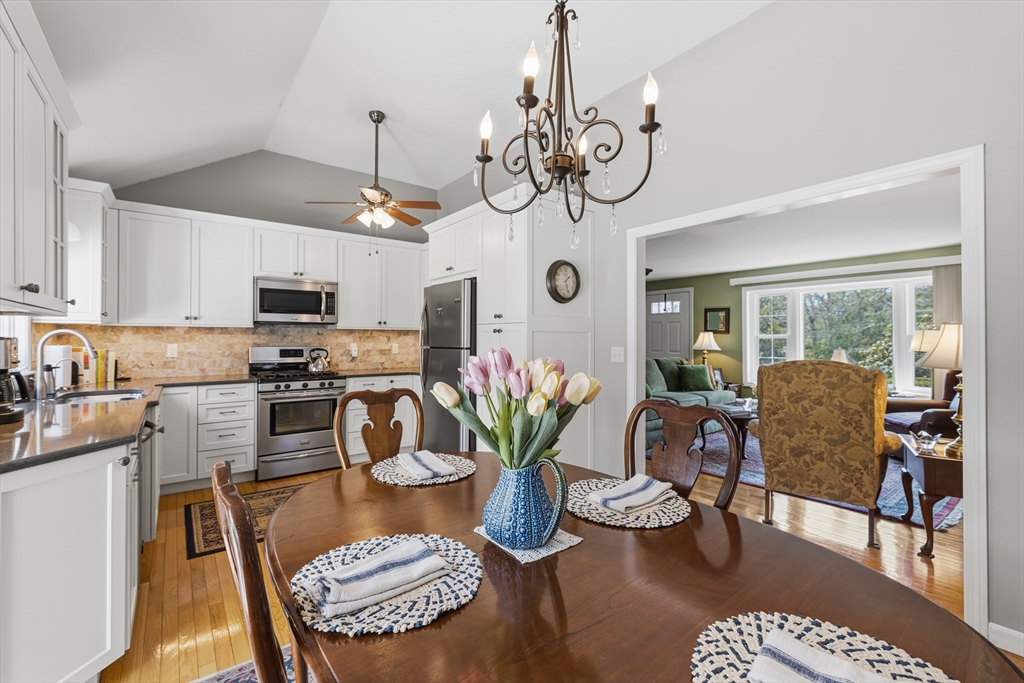 1 Susan Carsley Way Sandwich, MA 02563 - Photo 31 of 39 a dining room with furniture a chandelier and wooden floor