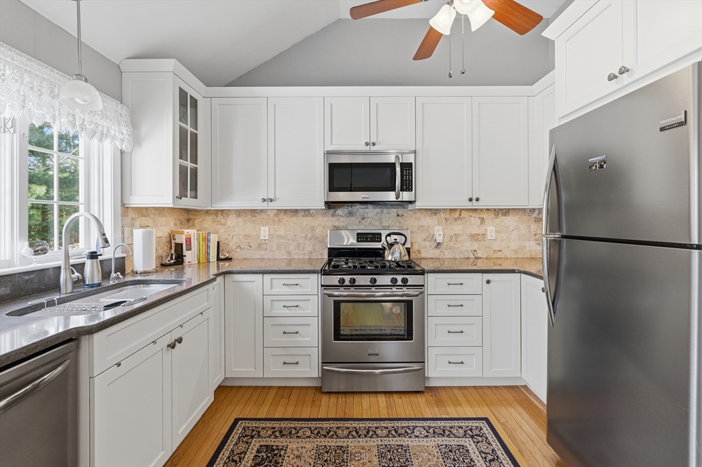 1 Susan Carsley Way Sandwich, MA 02563 - Photo 32 of 39 a kitchen with stainless steel appliances granite countertop a refrigerator sink and stove