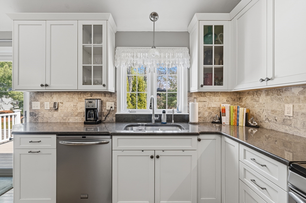 1 Susan Carsley Way Sandwich, MA 02563 - Photo 33 of 39 a kitchen with stainless steel appliances granite countertop a sink and a white cabinets