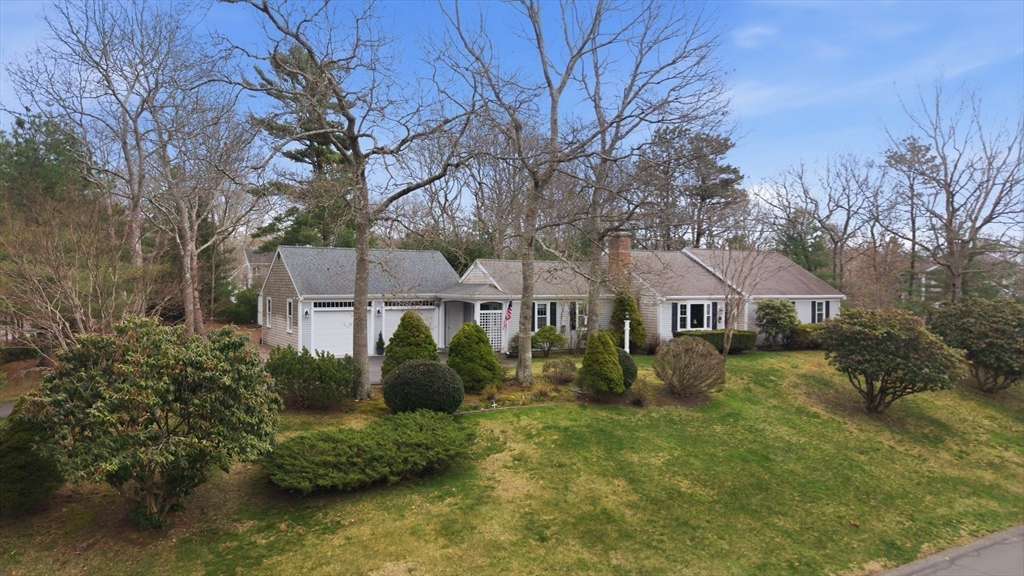 1 Susan Carsley Way Sandwich, MA 02563 - Photo 7 of 39 a front view of a house with a garden