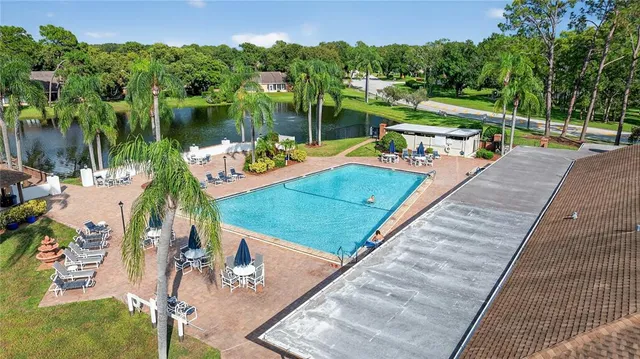 an aerial view of house with a yard