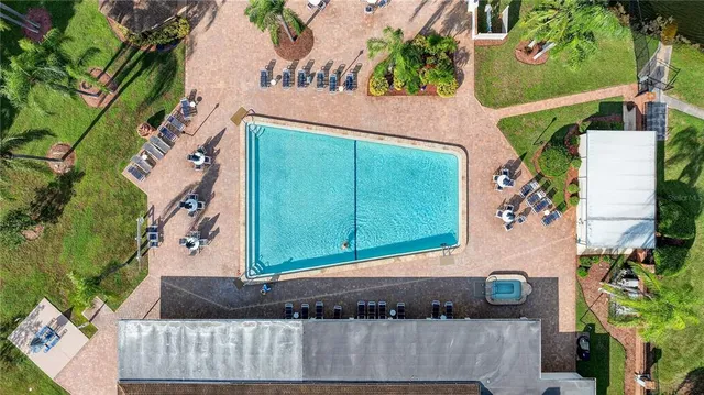 a view of a tennis ground with large trees