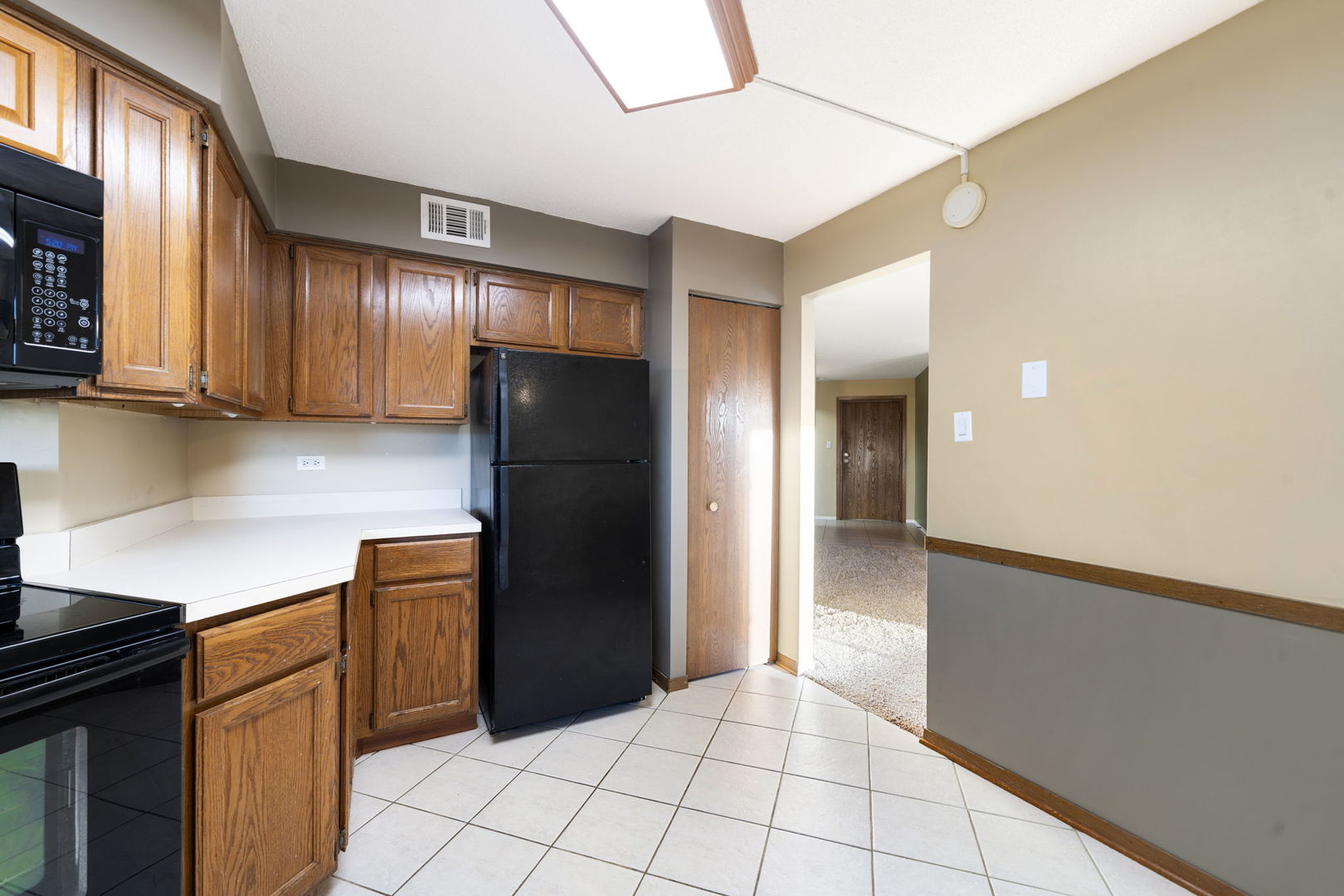 6421 Pershing Road, Unit 404 Berwyn, IL 60402 - Photo 11 of 31 a kitchen with stainless steel appliances granite countertop a refrigerator and a sink