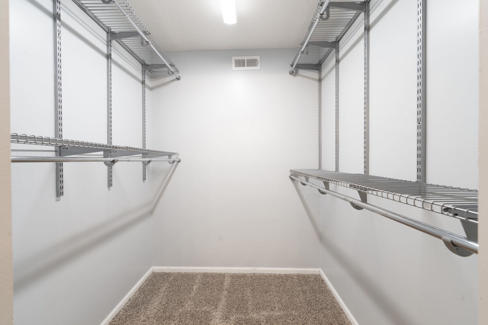 6421 Pershing Road, Unit 404 Berwyn, IL 60402 - Photo 19 of 31 a view of walk in closet with empty racks