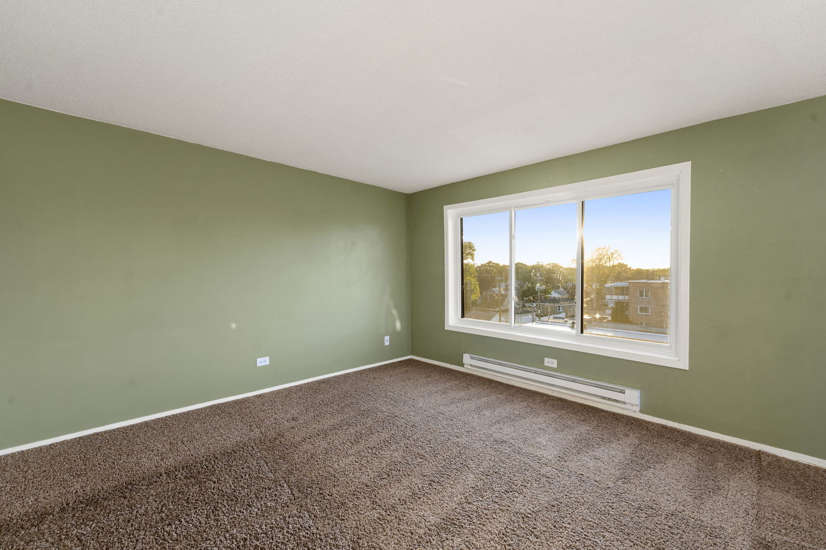 6421 Pershing Road, Unit 404 Berwyn, IL 60402 - Photo 6 of 31 a view of an empty room with a window