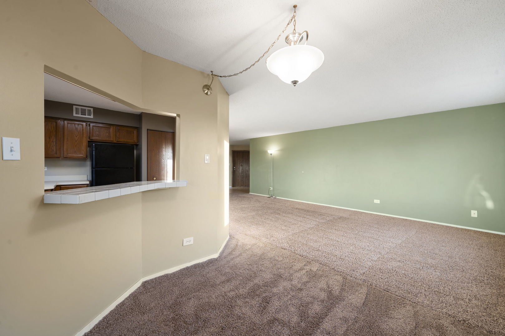 6421 Pershing Road, Unit 404 Berwyn, IL 60402 - Photo 7 of 31 a view of an empty room with a fireplace