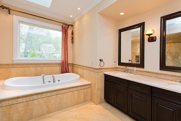 21 Clifton Road Newton, MA 02459 - Photo 12 of 22 a bathroom with a double vanity sink bathtub and next to a window