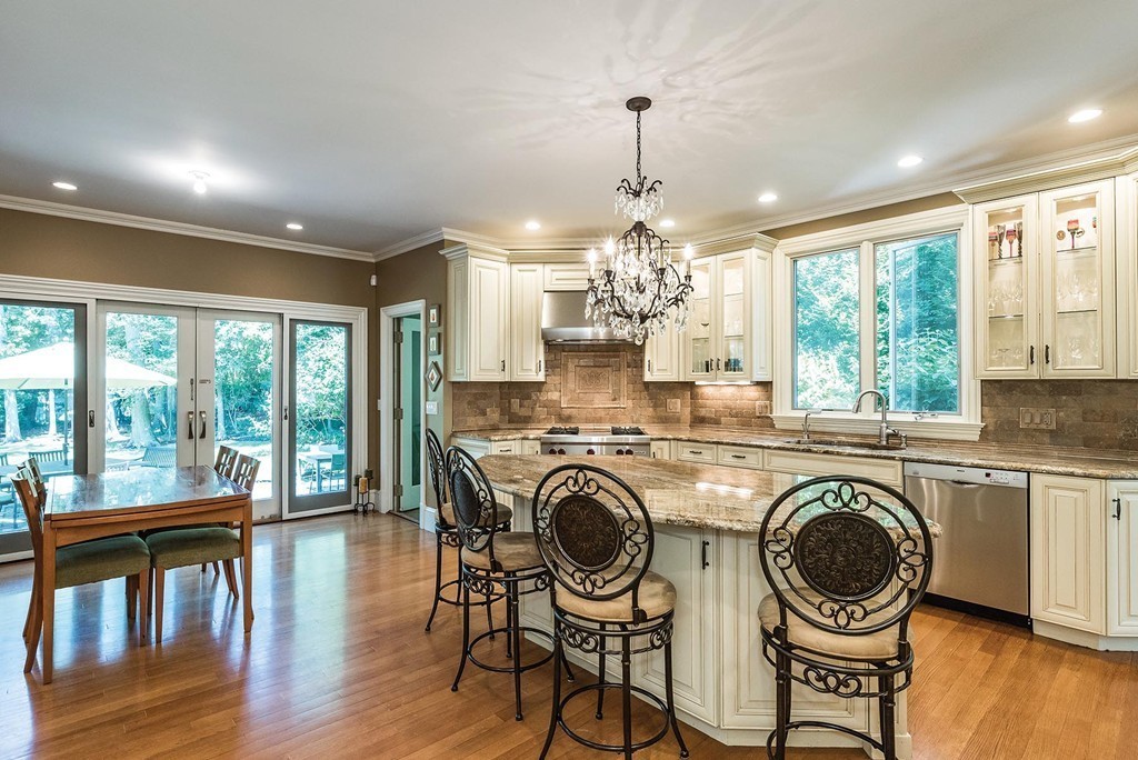 21 Clifton Road Newton, MA 02459 - Photo 4 of 22 a view of a kitchen with granite countertop a stove and a wooden floors