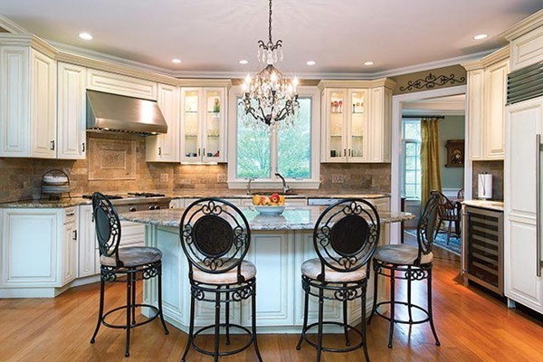 21 Clifton Road Newton, MA 02459 - Photo 5 of 22 a kitchen with stainless steel appliances granite countertop a stove top oven a sink a dining table and chairs