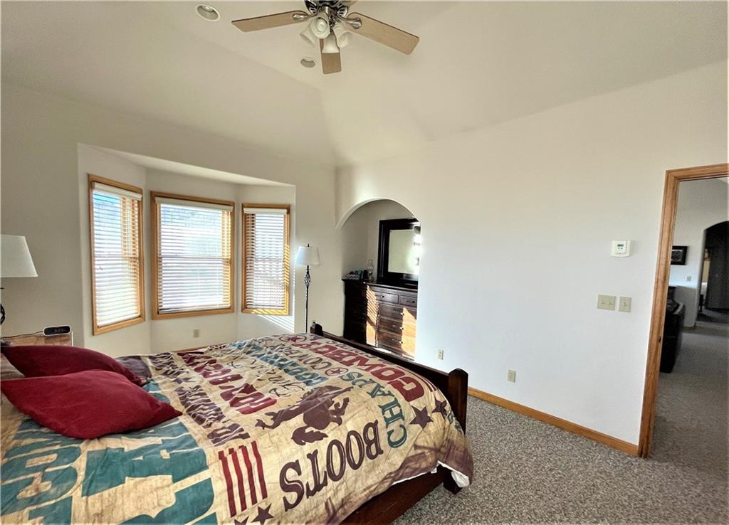 114 Round Hill Road Fairplay, CO 80440 - Photo 16 of 35 a bedroom with a bed and a chandelier