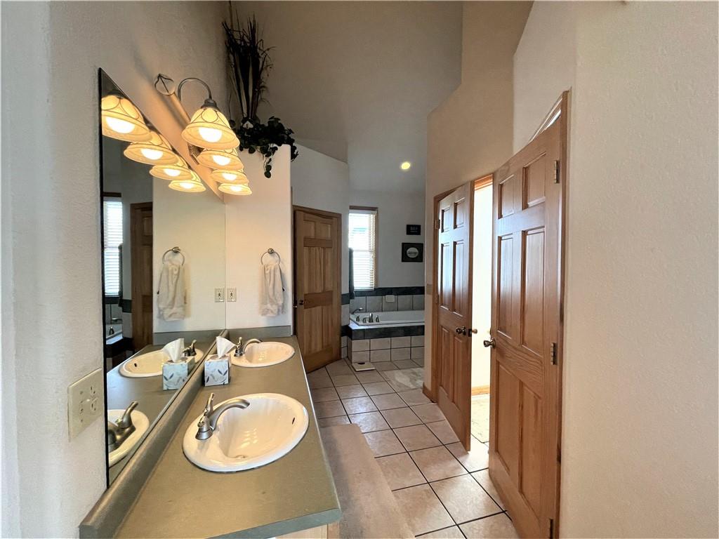 114 Round Hill Road Fairplay, CO 80440 - Photo 17 of 35 a bathroom with a sink double vanity and a mirror