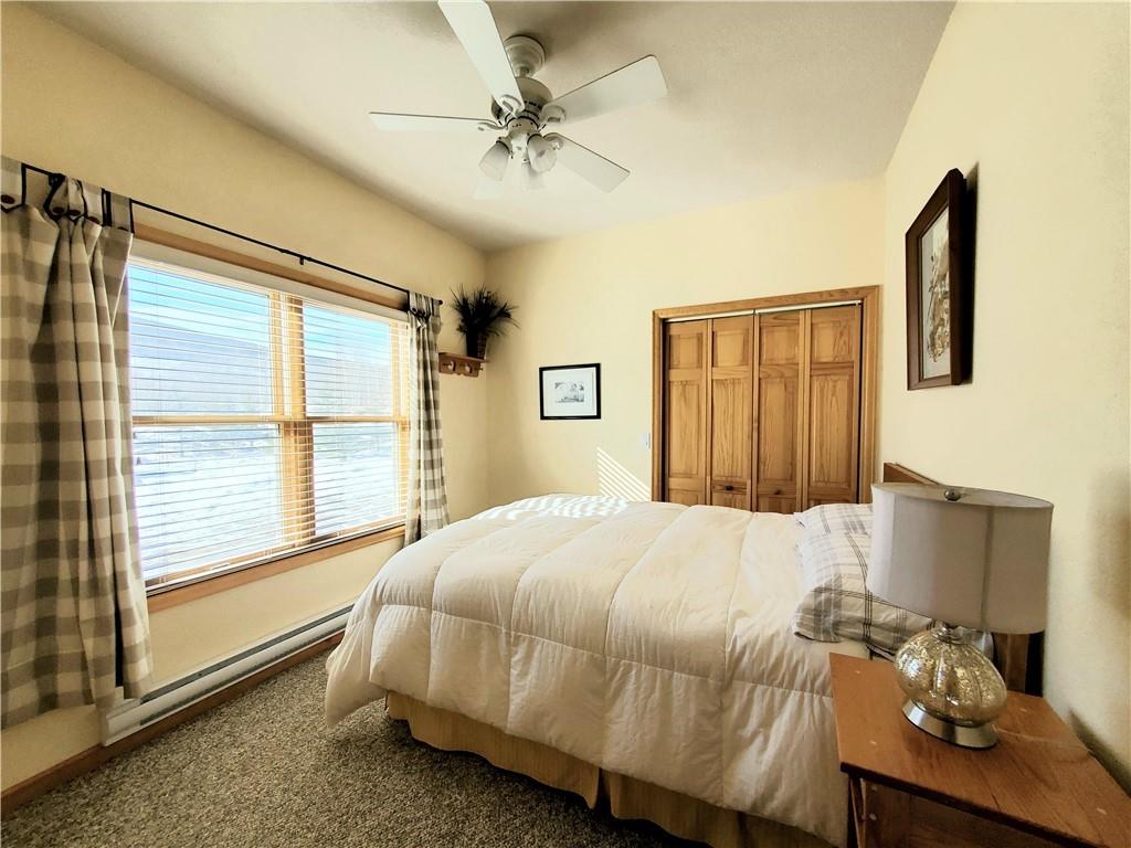 114 Round Hill Road Fairplay, CO 80440 - Photo 19 of 35 a bedroom with a bed and a table