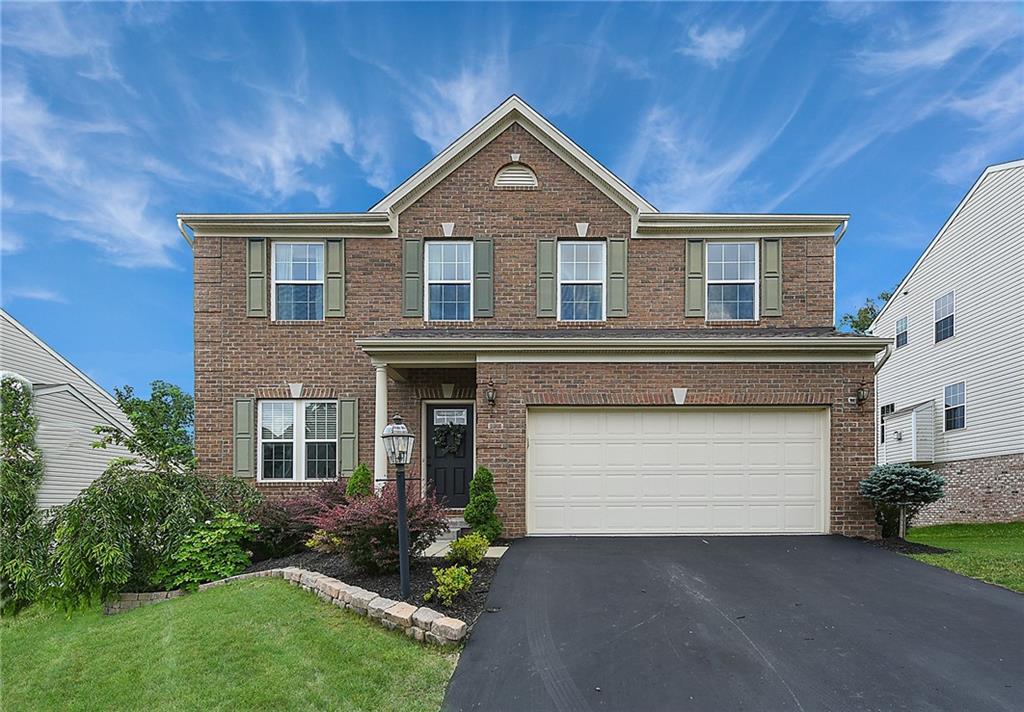 179 Broadstone Drive Mars, PA 16046 - Photo 1 of 25 a front view of a house with a yard and garage