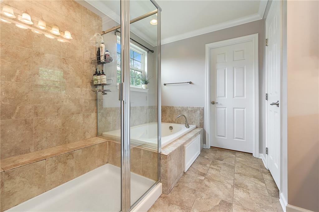 179 Broadstone Drive Mars, PA 16046 - Photo 16 of 25 a bathroom with a tub and shower