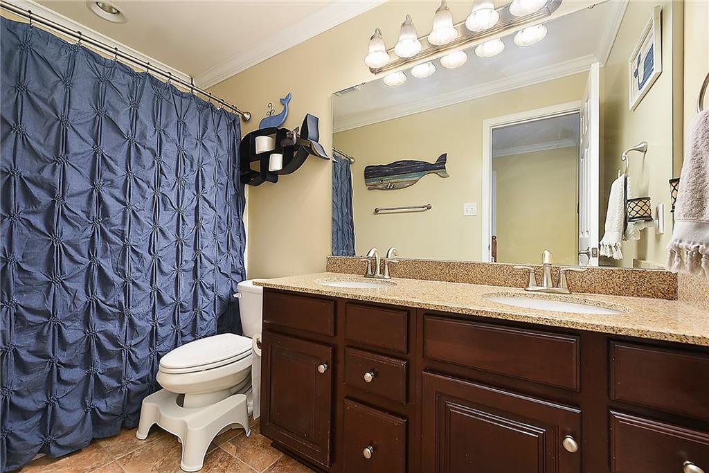 179 Broadstone Drive Mars, PA 16046 - Photo 19 of 25 a bathroom with a granite countertop sink mirror vanity and toilet
