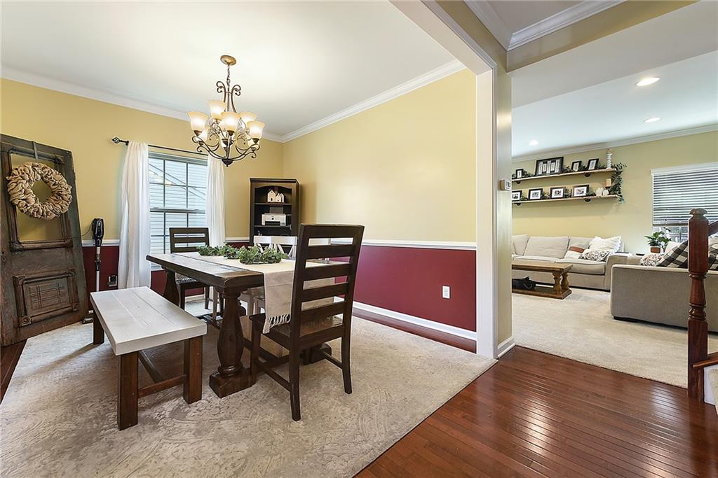 179 Broadstone Drive Mars, PA 16046 - Photo 4 of 25 a view of a dining room with furniture a chandelier and wooden floor