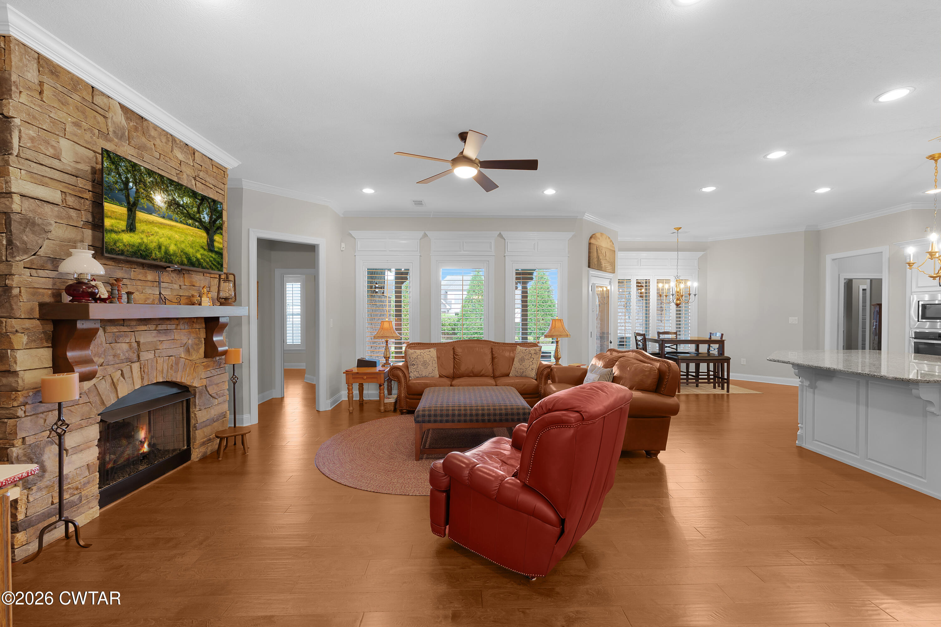 34 Cheddleton Cove Jackson, TN 38305 - Photo 7 of 32 a living room with furniture a fireplace and a flat screen tv