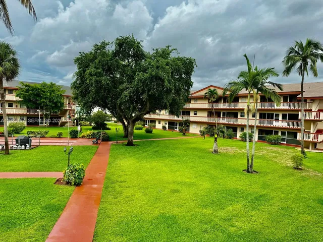 a front view of a house with a yard table and chairs