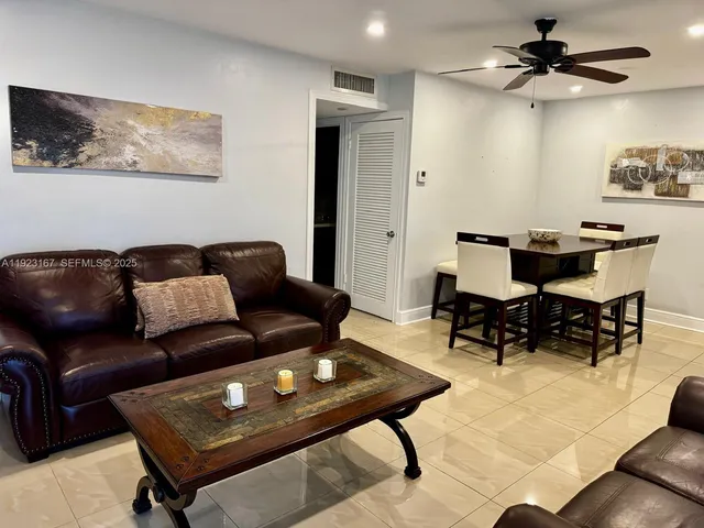 a living room with furniture and a rug