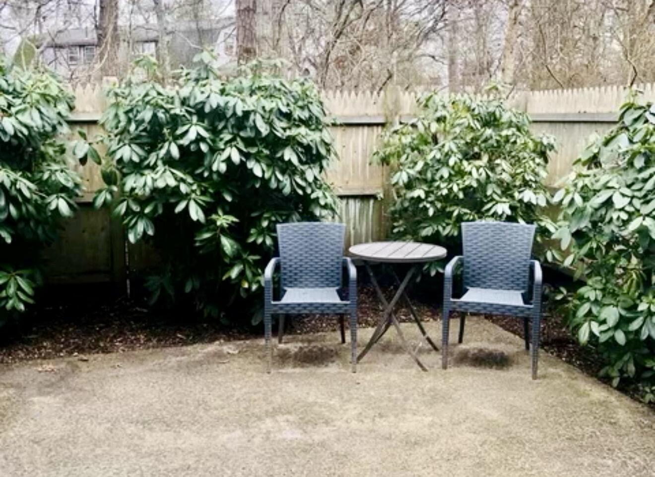 135 West Main Street, Unit 26 Hyannis, MA 02601 - Photo 9 of 9 a view of a chairs and table in a backyard