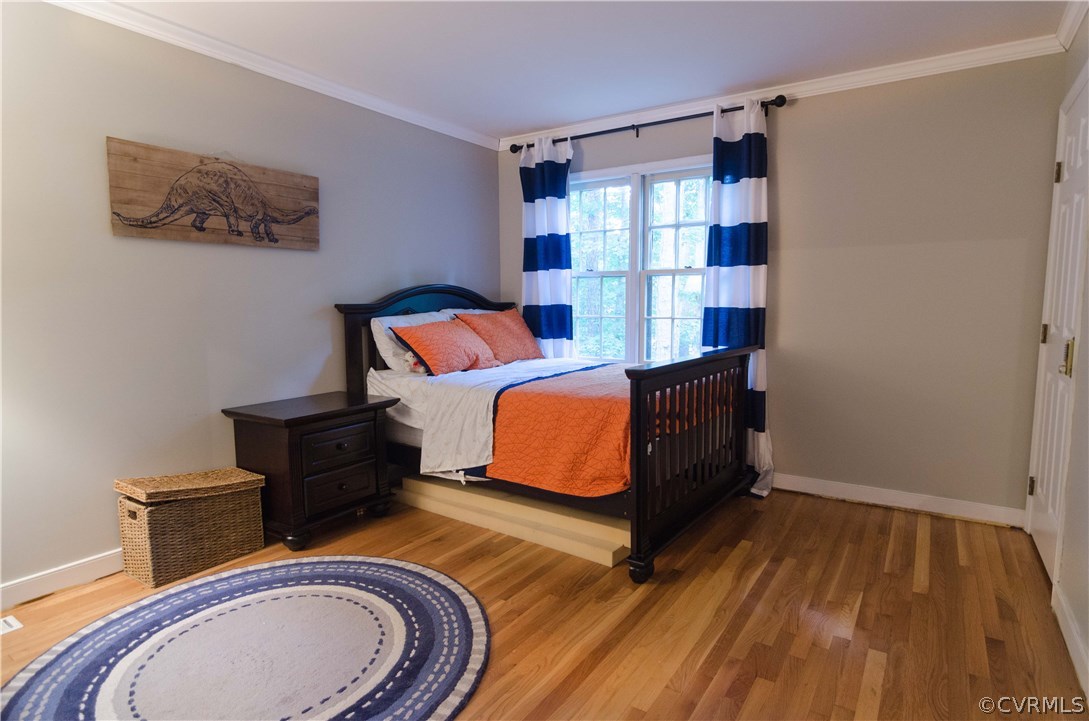 3207 Fox Chase Road Midlothian, VA 23112 - Photo 16 of 21 a bedroom with a bed and wooden floor