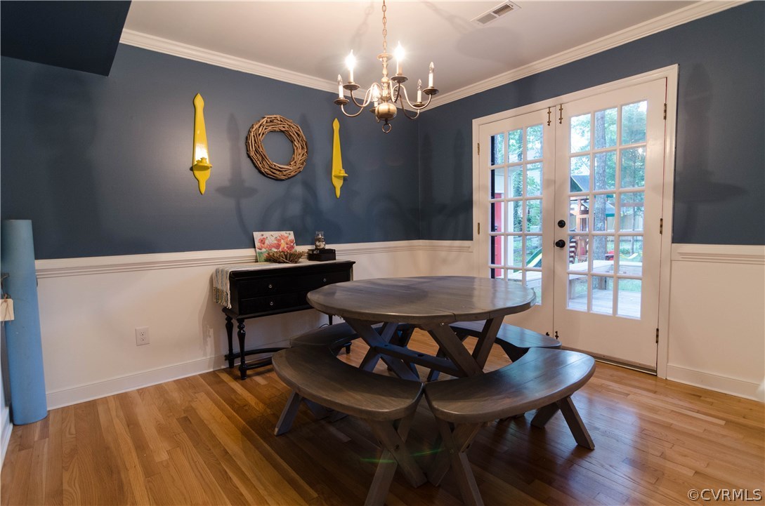 3207 Fox Chase Road Midlothian, VA 23112 - Photo 7 of 21 a view of a dining room with furniture and chandelier