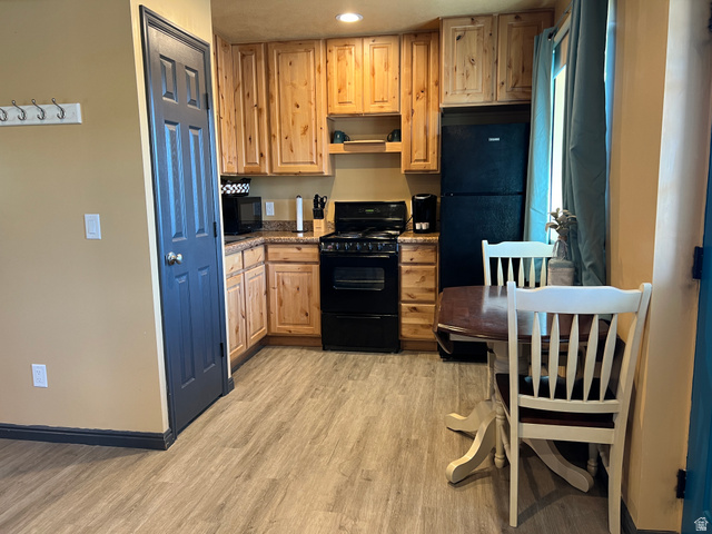 890 East Hatchery Road Bicknell, UT 84715 - Photo 8 of 48 Kitchen featuring black appliances, light wood-style flooring, light brown cabinets, and recessed lighting