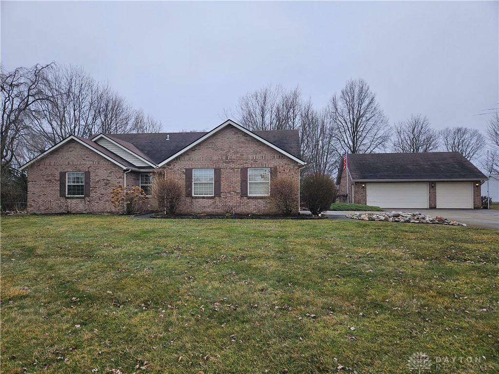 4909 Shannon Avenue Springfield, OH 45504 - Photo 1 of 21 This classic brick residence features an attached garage and expansive front yard, offering comfort and convenience.
