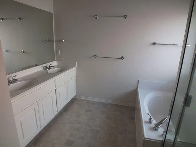 a bathroom with a sink and mirror