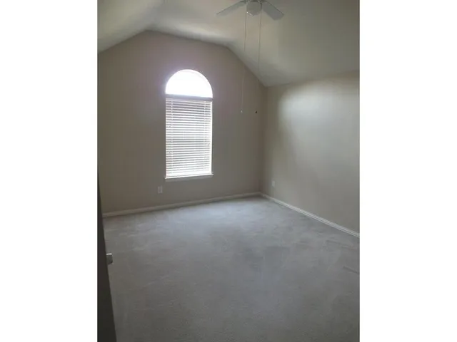 a view of empty room with windows