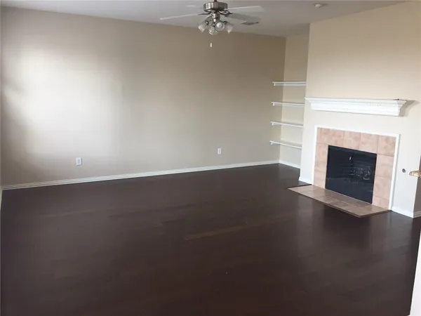 an empty room with a fireplace