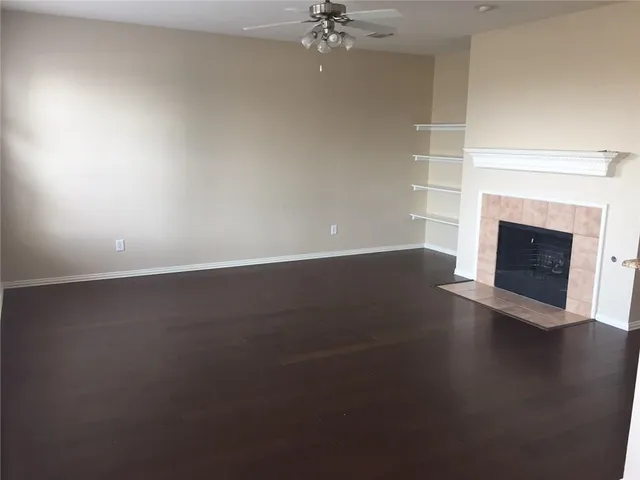 an empty room with a fireplace