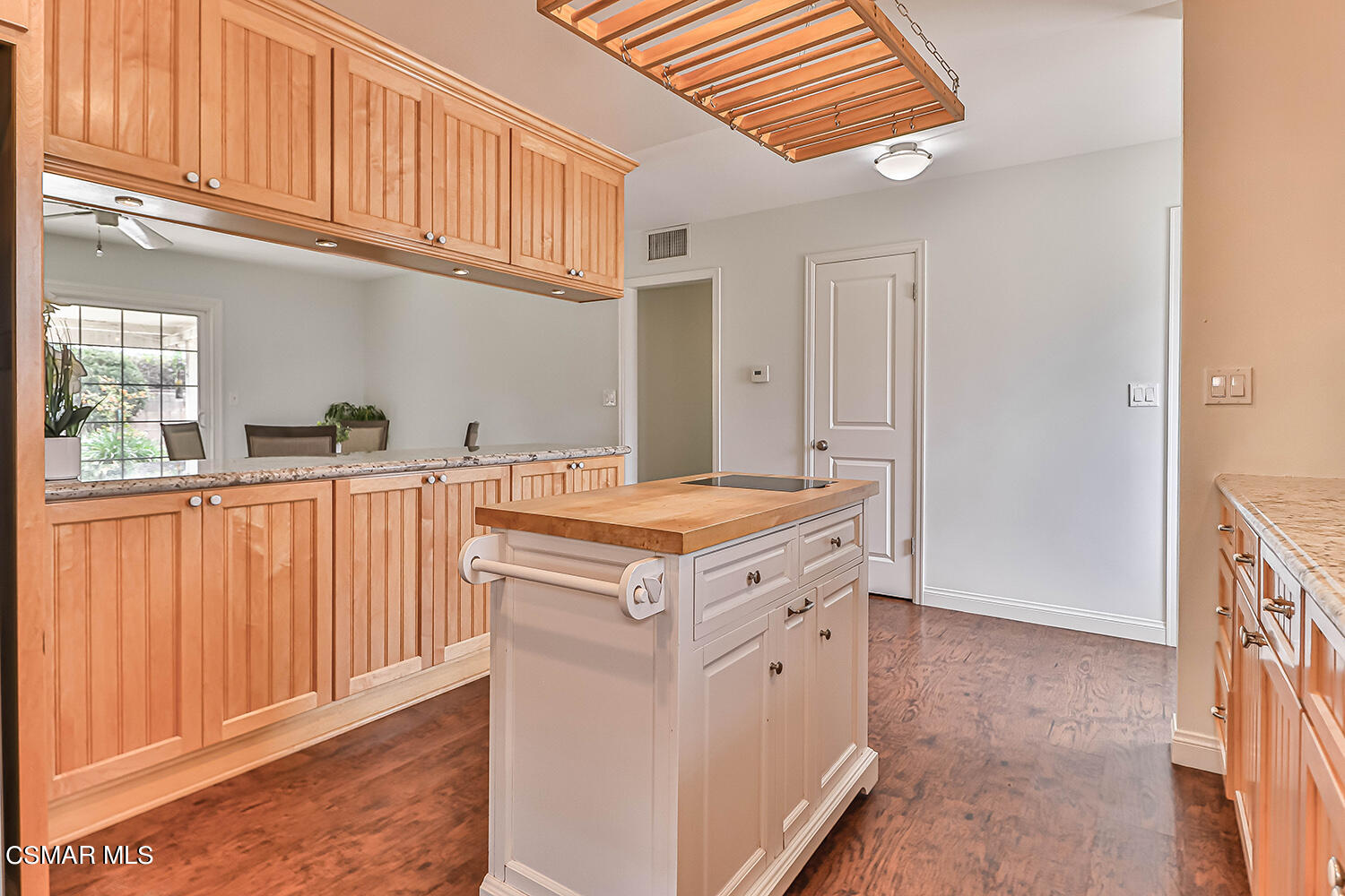 1648 Spence Street Simi Valley, CA 93065 - Photo 11 of 41 a kitchen with granite countertop a sink and a stove