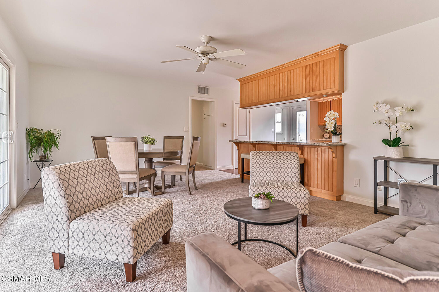 1648 Spence Street Simi Valley, CA 93065 - Photo 15 of 41 a living room with furniture and a chandelier