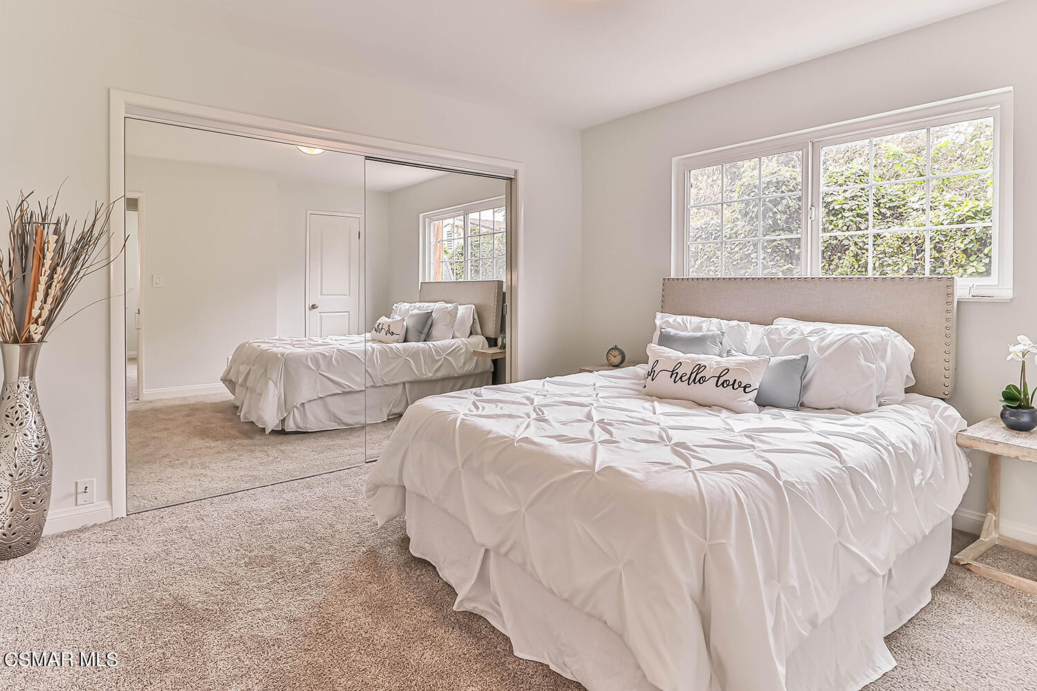 1648 Spence Street Simi Valley, CA 93065 - Photo 17 of 41 a bedroom with two beds and a large mirror next to a window