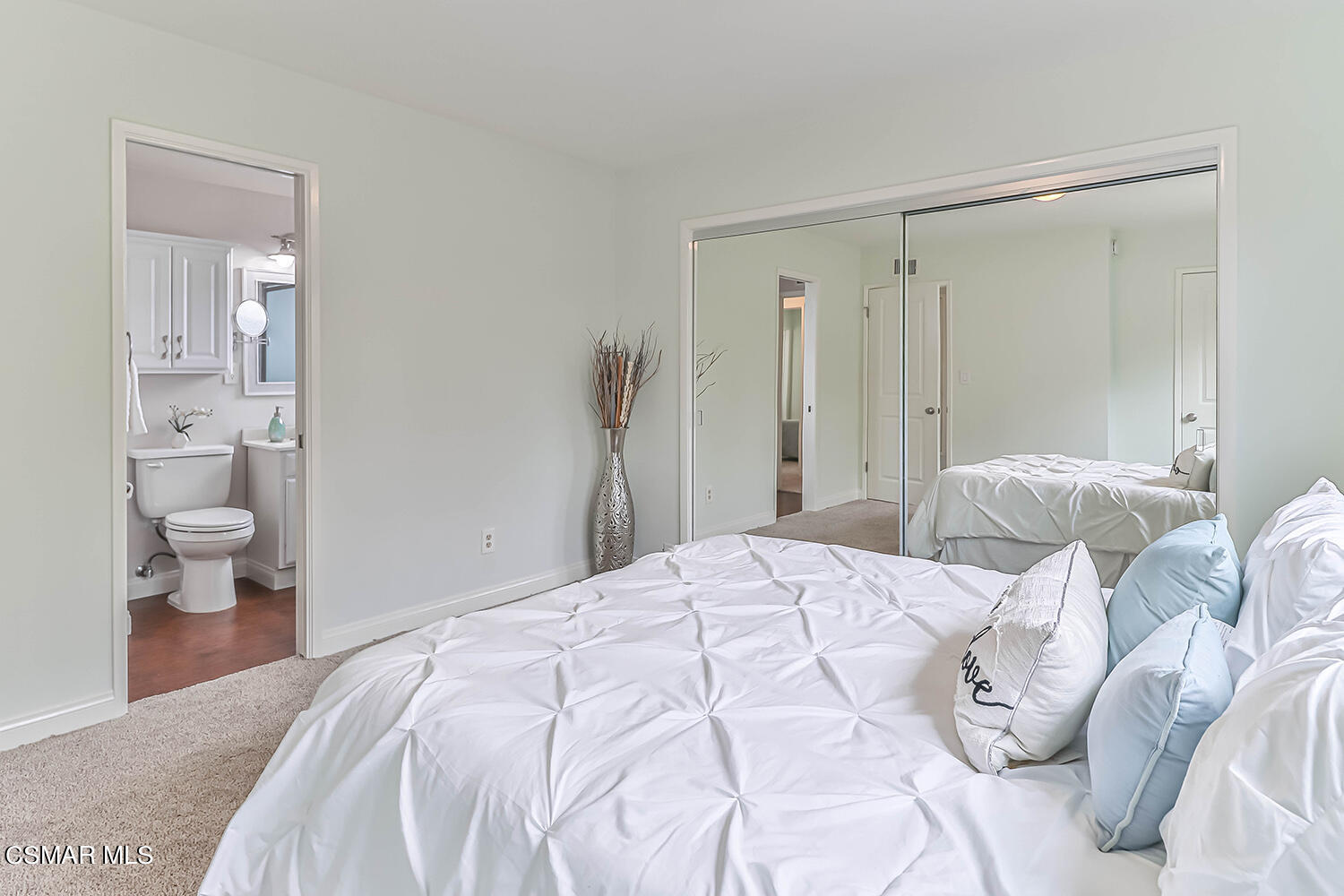 1648 Spence Street Simi Valley, CA 93065 - Photo 19 of 41 a bedroom with a bed and a lamp