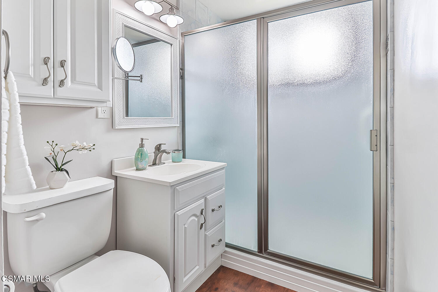 1648 Spence Street Simi Valley, CA 93065 - Photo 20 of 41 a bathroom with a toilet sink and mirror