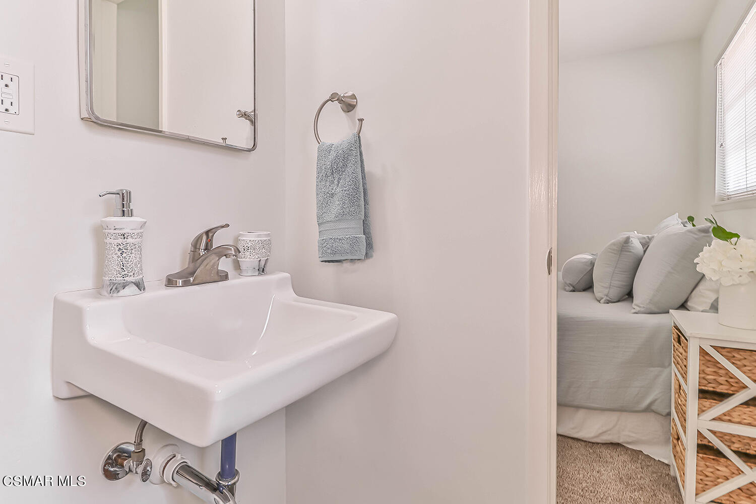1648 Spence Street Simi Valley, CA 93065 - Photo 25 of 41 a bathroom with a sink and a mirror