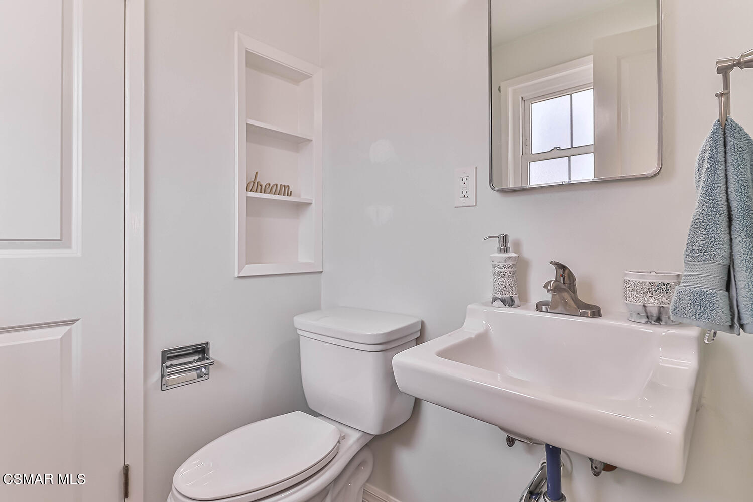 1648 Spence Street Simi Valley, CA 93065 - Photo 26 of 41 a white toilet sitting next to a bathroom sink