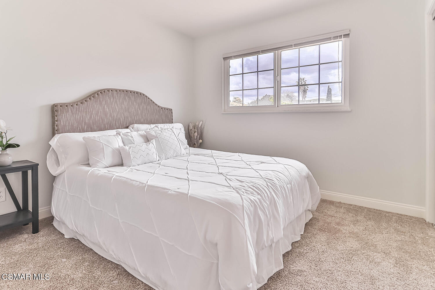 1648 Spence Street Simi Valley, CA 93065 - Photo 29 of 41 a bedroom with a bed and a window