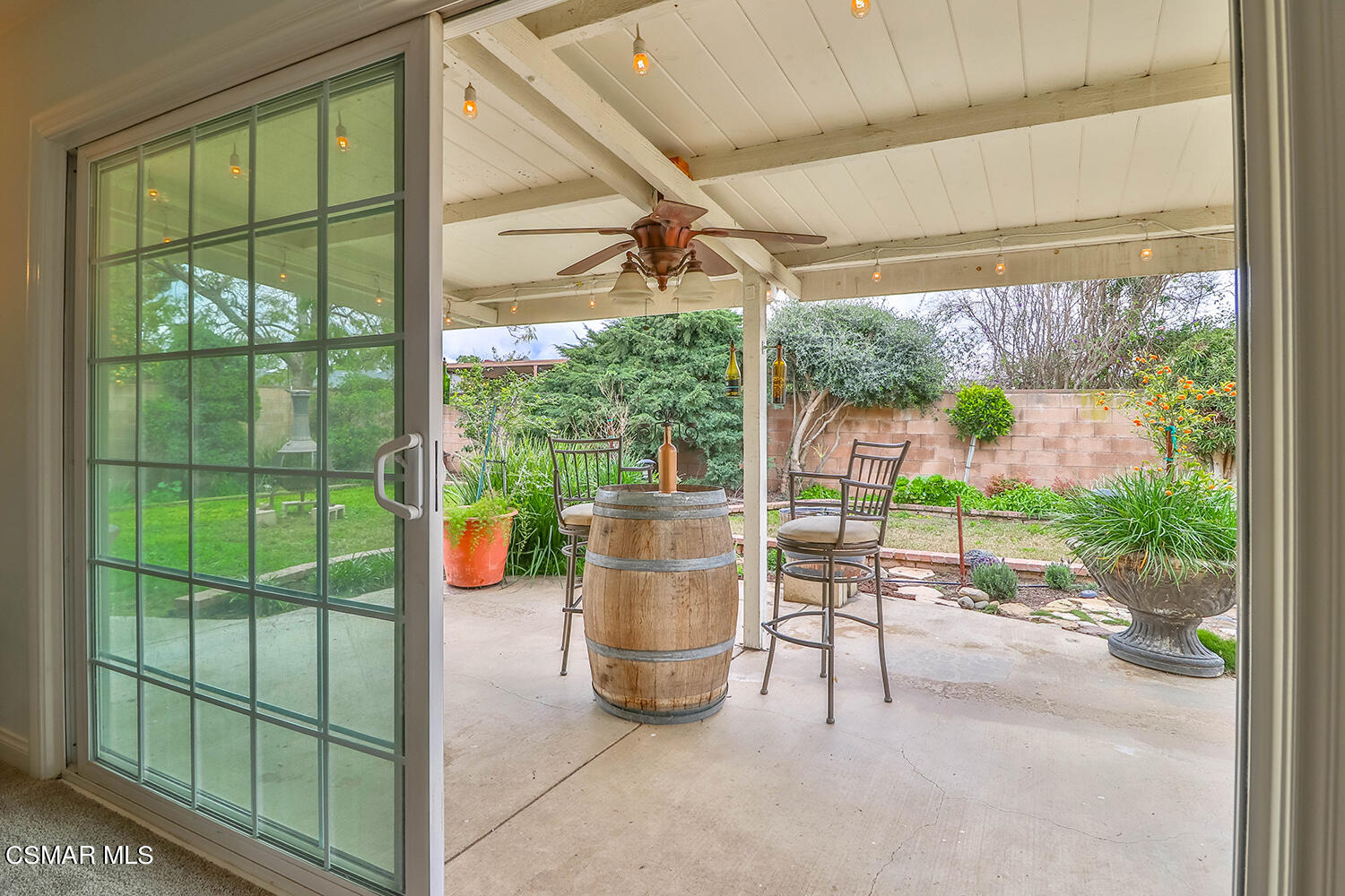 1648 Spence Street Simi Valley, CA 93065 - Photo 31 of 41 a living room with a floor to ceiling window and a table