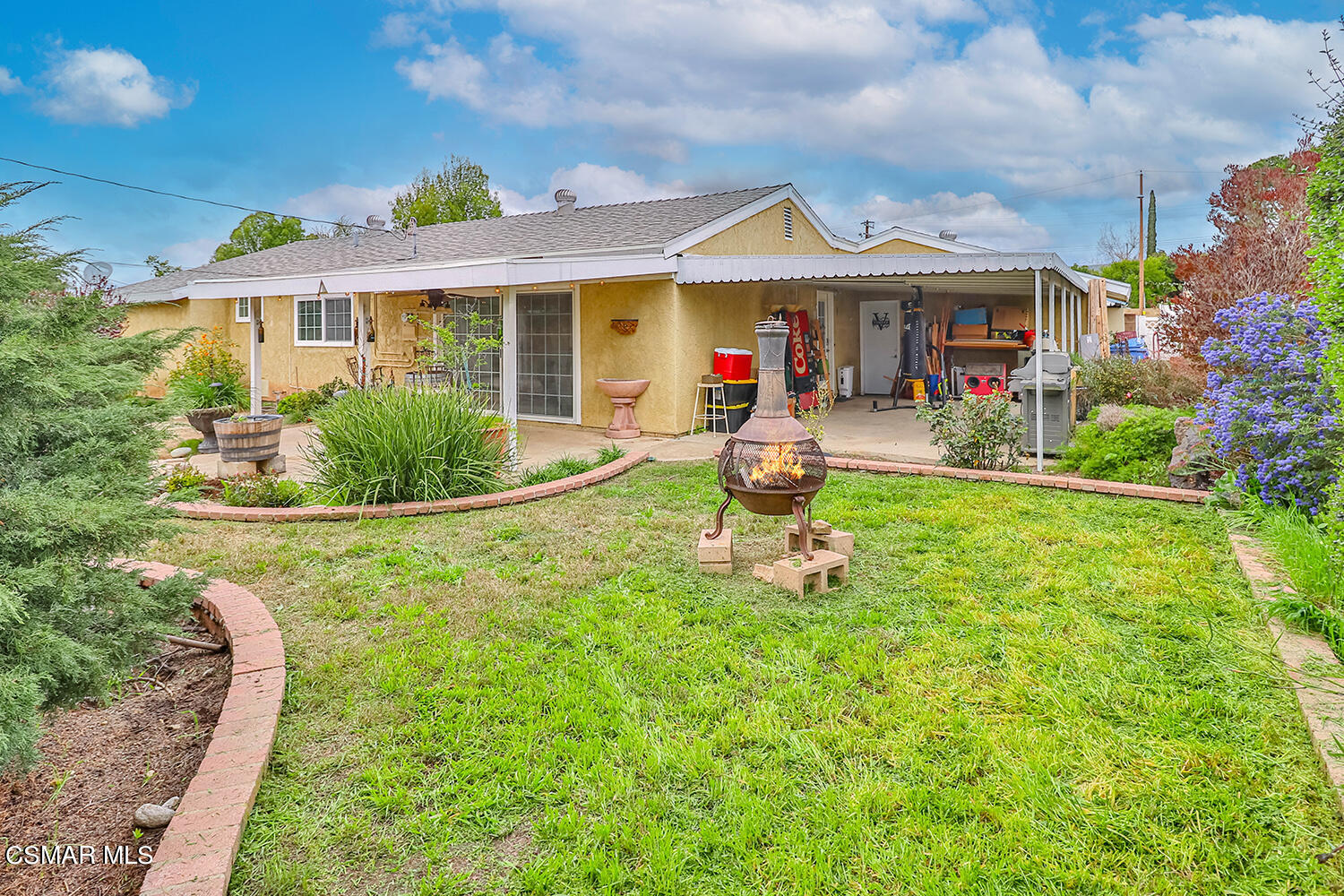 1648 Spence Street Simi Valley, CA 93065 - Photo 34 of 41 a front view of a house with garden and porch