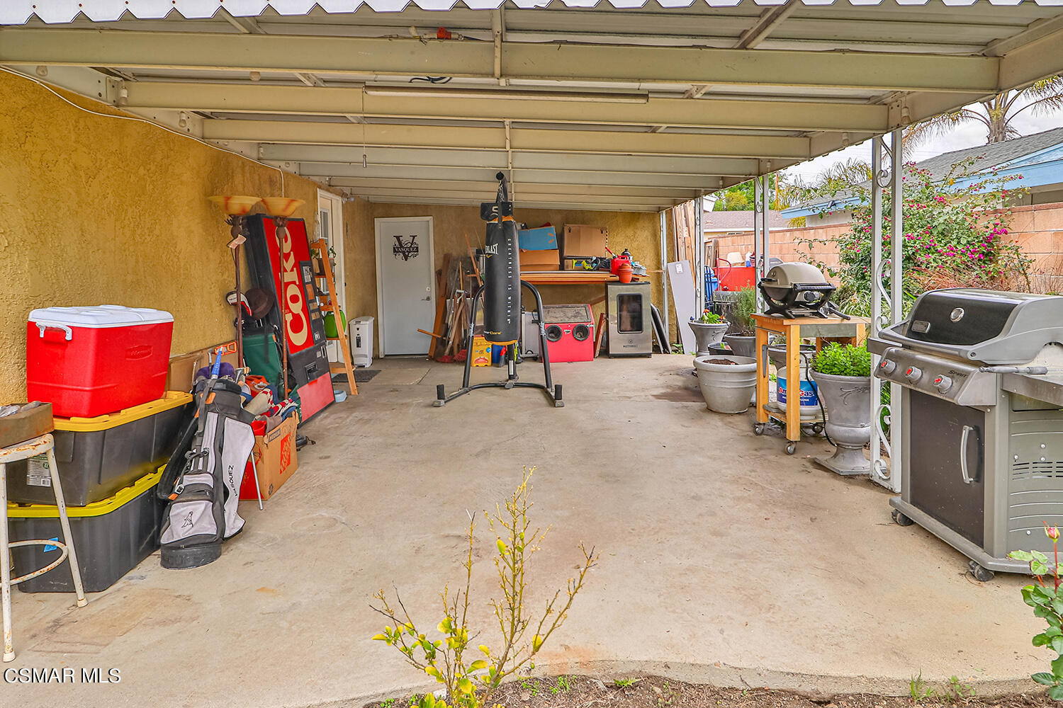 1648 Spence Street Simi Valley, CA 93065 - Photo 35 of 41 a view of a garage with a bike and a roof